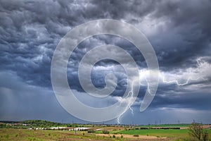 Summer thunderstorm over the meadow