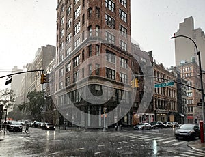 Summer thunderstorm raining on the intersection of Broadway and 12th Street in New York City