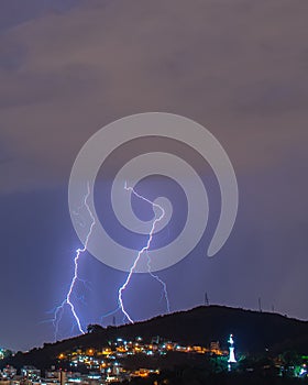 Images of the arrival of a strong summer storm with lightning and rain. Event in the city in the late afternoon, early evening in photo