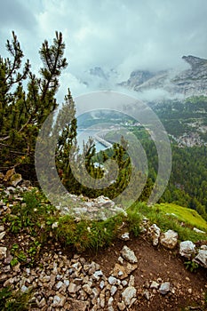 Summer time in Dolomites. landscape with mountains, clouds, rocks and forest