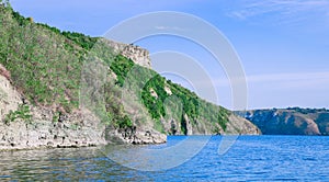 summer time vacation landscape destination site of wilderness natural environment space lake and hill rocks in clear weather day