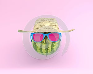 Summer times of funny attractive watermelon in stylish sunglasses with hat on pink background. minimal fruit concept. Creative id