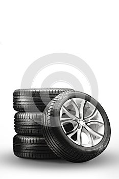 summer tires and wheels - stack on a white background, new wheels vertical photo