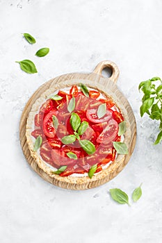 Summer tomato tart with soft cheese and basil