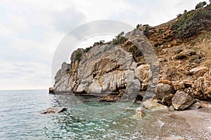 Summer travel concept. Beautiful bay surrounded by rocks