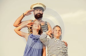 Summer travel concept. Happy family. Dad sailor and daughters outdoors. Captain welcome on board. Marine tour. Sea