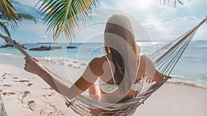 Summer travel concept, Happy traveler young woman with bikini relax in hammock on beach