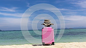 Summer travel concept with Pink luggage on the white sand Beach background banner travel image