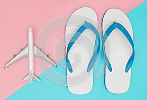 Summer travel with plane and beach sandals