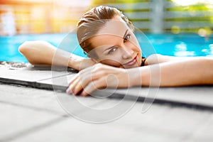 Summer Travel Vacation. Woman Relaxing In Pool. Healthy Lifestyle, Wellness.