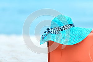 Summer traveling with old suitcase and Fashion woman, fish star, sun glasses, hat. Travel in the holiday, blue sky and beach backg