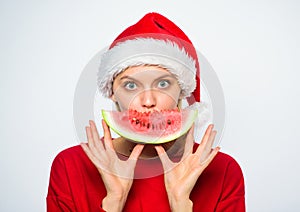 Summer treats on christmas party. Exotic christmas concept. Christmas girl eat watermelon. Exotic winter holiday