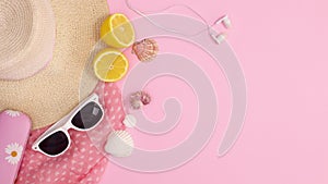 Summer trendy beach accessories move on pastel pink background. Stop motion flat lay