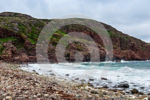 Summer tundra. Rocky coastline of Barents Sea near Teriberka. Scenery of Russian North. Kola Peninsula, Murmansk Oblast