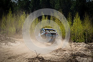 Summer UTV, ATV & offroad driving in dust. Quad racing