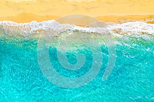 Summer vacation background. Drone aerial view of turquoise ocean waves and the sandy coastline. Exotic tropical beach in Dominican