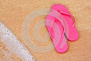 Summer vacation background flip flops on beach