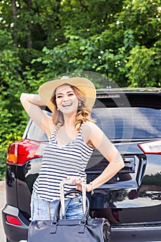 Summer vacation car road trip freedom concept. Happy woman cheering joyful during holiday travel with car.