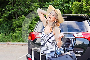 Summer vacation car road trip freedom concept. Happy woman cheering joyful during holiday travel with car.