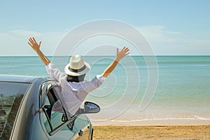 Family car trip at the sea, Asian woman feeling happiness.