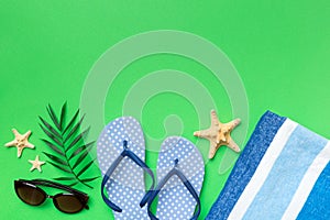 Summer vacation concept flat lay. beach accessories and towel top view. Space for text. travel concept