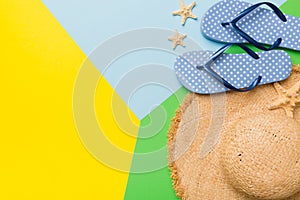 Summer vacation concept flat lay. straw hat beach accessories and flip flop top view. Space for text. travel concept