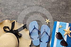 Summer vacation concept flat lay. straw hat beach accessories and towel top view. Space for text. travel concept