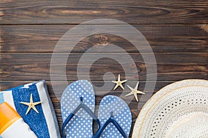 Summer vacation concept flat lay. straw hat beach accessories and towel top view. Space for text. travel concept