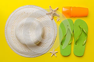 Summer vacation concept flat lay. straw hat beach accessories and towel top view. Space for text. travel concept