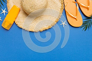 Summer vacation concept flat lay. straw hat beach accessories and towel top view. Space for text. travel concept