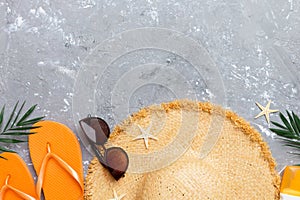 Summer vacation concept flat lay. straw hat beach accessories and towel top view. Space for text. travel concept