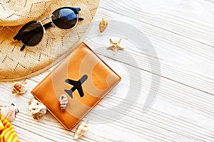 Summer vacation concept flat lay. yellow hat, sunglasses and sh