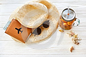 Summer vacation concept. yellow cocktail juice with apricot, hat