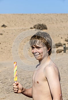 Summer vacation: cute teen with icecream at the beach