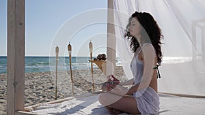 Summer vacation, deep breath girl on shore ocean, woman meditating to beach, women doing yoga to embankment,