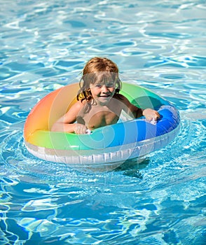 Summer vacation fun. Cute kid in swimming pool.
