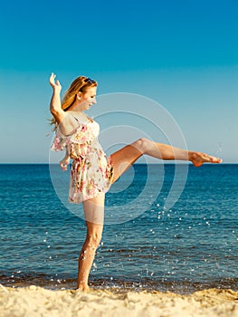 Summer vacation. Girl having fun on the sea coast