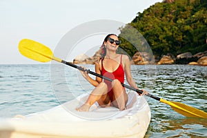 Summer Vacation. Happy Woman Traveling On Canoe In Sea