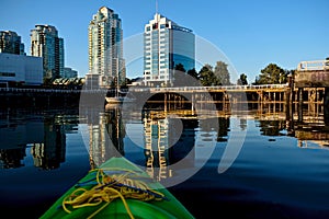 Summer vacation. Kayaking boating in False Creek in Vancouver downtown.