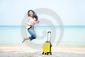 Summer Vacation. Lifestyle woman walking and jumping relax happy on beach