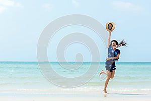 Summer Vacation. Lifestyle woman walking and jumping relax happy on beach tropical outdoor