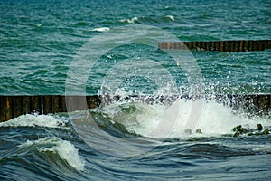 Summer vacation on the Sea - seascape with beautiful wave and breakwaters.