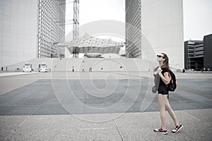 Summer vacation. Sightseeing guide. Girl tourist sunglasses enjoy city center square. Woman stand in front of urban