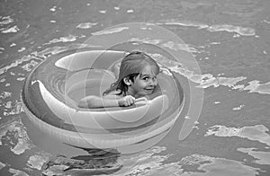 Summer vacation. Summertime childs weekend. Boy in swiming pool with inflatable rubber circle.