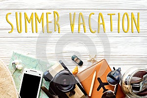 summer vacation text, time to travel concept, wanderlust vacation background flat lay. camera sunglasses passport money map phone