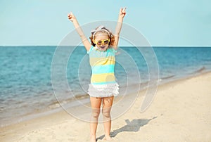 Summer vacation, travel concept - little girl child having fun on beach