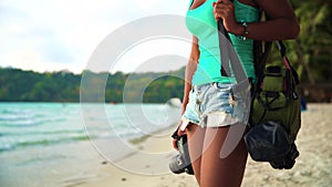 Summer vacation, travel and lifestyle concept: carefree woman with camera enjoy sunset over tropical beach