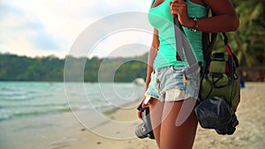 Summer vacation, travel and lifestyle concept: carefree woman with camera enjoy sunset over tropical beach