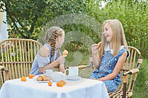 Summer vacation - Two little girls having tea