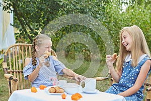 Summer vacation - Two little girls having tea